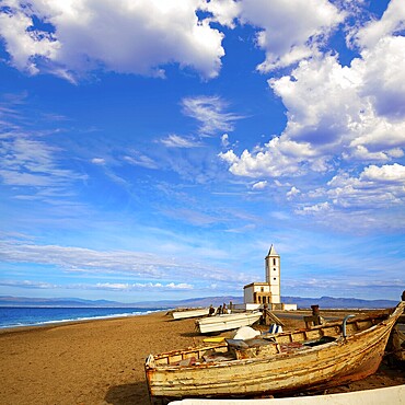 Cabo de Gata in Almeria at San Miguel Beach and Salinas church with stranded boats