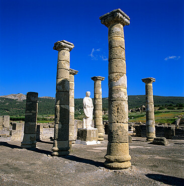 Roman ruins with statue of Emperor Trajan, Baelo Claudia, near Tarifa, Andalucia, Spain, Europe