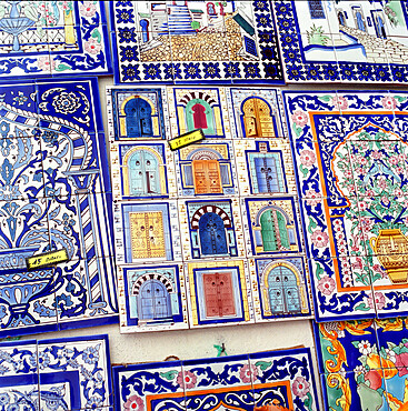 Tiles decorated with Tunisian doorways on souvenir stall, Hammamet, Cap Bon, Tunisia, North Africa, Africa