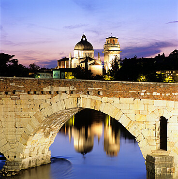 Ponte Pietra and the River Adige with San Giorgio in Braida at dusk, Verona, UNESCO World Heritage Site, Veneto, Italy, Europe