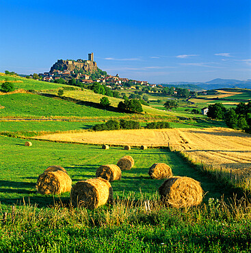 Chateau de Polignac and hay bales, Polignac, Haute-Loire, Auvergne, France, Europe