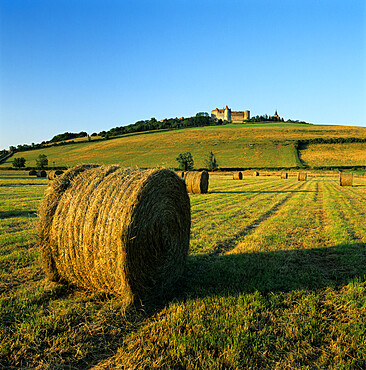 Hay bales below the Chateau, Chateauneuf, Burgundy, France, Europe