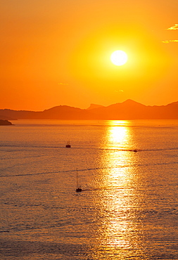 Fishing boats and speed boats return at dusk, with the island of Kolocep in the background, Dubrovnik, Croatia, Europe