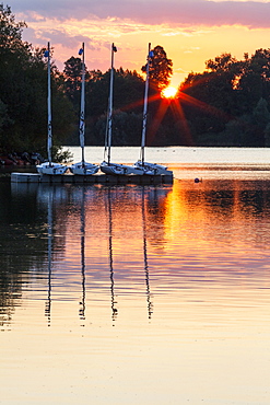 Boats by a pontoon during sunset at Bray Lake, Berkshire, England, United Kingdom, Europe