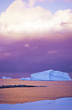 Sunset over iceberg, Gerlache Strait, Antarctica, Southern Ocean.