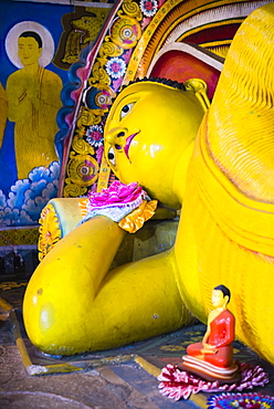 Golden reclining Buddha at Temple of the Tooth (Temple of the Sacred Tooth Relic) in Kandy, UNESCO World Heritage Site, Sri Lanka, Asia