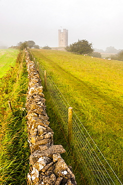 Misty sunrise at Broadway Tower, a National Trust property at Broadway, The Cotswolds, Gloucestershire, England, United Kingdom, Europe 