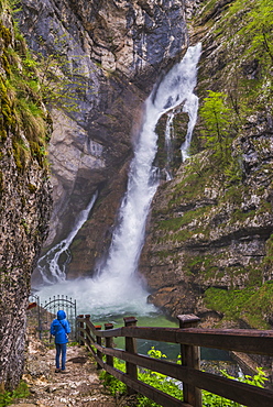 Tourist at Savica Waterfall near Lake Bohinj, Triglav National Park, Julian Alps, Slovenia, Europe