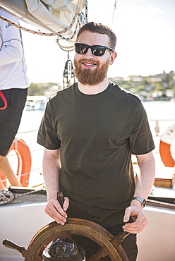 Tourist on a sailing boat trip in the Bay of Islands, from Russell, Northland Region, North Island, New Zealand, Pacific