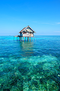 Huts built over the water by the Bajau Fishermen who live there three months of the year, Togian Islands, Indonesia, Southeast Asia, Asia