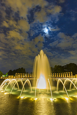 Views at night of the fountains at the U.S. National World War II Memorial, Washington, D.C., United States of America.