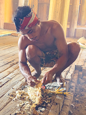 Traditional chicken meal being prepared in Waingapu, the largest town in the eastern half of Sumba Island, Indonesia