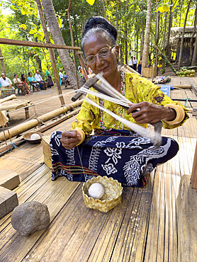 Woman making textiles in the village of Liangawo, on Flores Island, Lesser Sunda Islands, Indonesia.