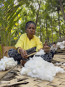 Woman making thread for textiles in the village of Liangawo, on Flores Island, Lesser Sunda Islands, Indonesia.