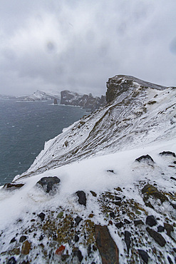 Snow covering the ash and mud slides at Deception Island, South Shetland Islands, Antarctica, Southern Ocean.