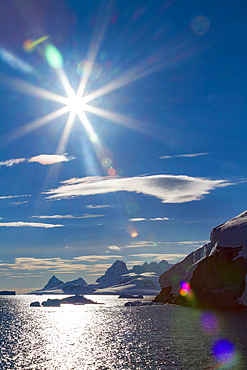 Icebergs surrounded by mountains in Paradise Bay, Antarctic Peninsula, Antarctica, Southern Ocean.
