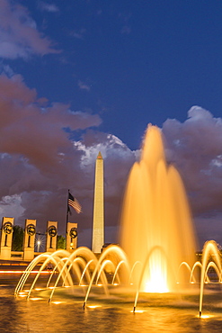 The Washington Monument lit up at night as seen from the World War II Monument, Washington D.C., United States of America, North America