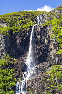 Ice melt waterfall on the Olden River as it flows along Briksdalen, Olden, Nordfjord, Norway, Scandinavia, Europe