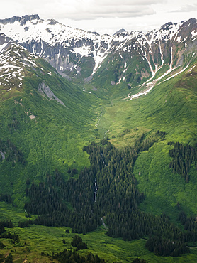 Aerial view of snow capped mountains as seen from a small private plane flying in Southeast Alaska, United States of America, North America