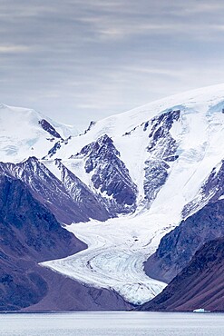 Tidewater glacier in the calm waters of Makinson Inlet, Ellesmere Island, Nunavut, Canada, North America