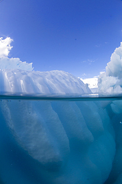 Half above and half below photo of an iceberg off Danco Island, Antarctica, Polar Regions