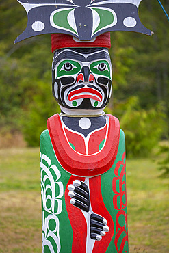 Kwakwaka'wakw totem poles in the cemetery in Alert Bay, Cormorant Island, British Columba, Canada.