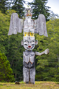 Kwakwaka'wakw totem poles in the cemetery in Alert Bay, Cormorant Island, British Columba, Canada.