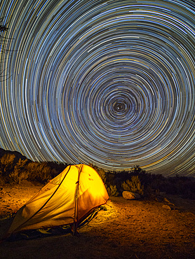 Night view of a pitched tent in the Alabama Hills National Scenic Area, California, USA.