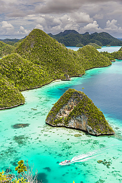 A view from on top of the small islets of the natural protected harbor in Wayag Bay, Raja Ampat, Indonesia, Southeast Asia, Asia