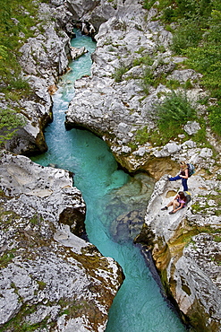 Two female hikers beside the river Soca, Alpe-Adria-Trail, Tolmin, Slovenia