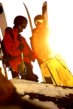 Two freeskiers standing on the top of a mountain, Chandolin, Canton of Valais, Switzerland