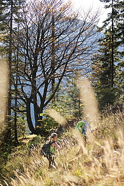 A man and a woman hiking in the mountains, Oberstdorf, Bavaria, Germany