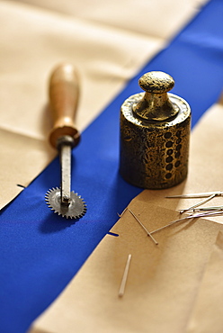 Material with pins and weights, dressmaking in Hamburg, Germany