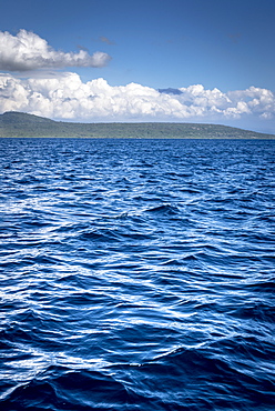 View from the sea to the mainland of East Java, scattered Clouds, Java, Indonesia