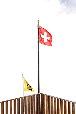 Swiss flag, Flag of Switzerland blowing in the wind, Finsteraarhornhut, Fiescher Glacier, Berner Oberland, Switzerland