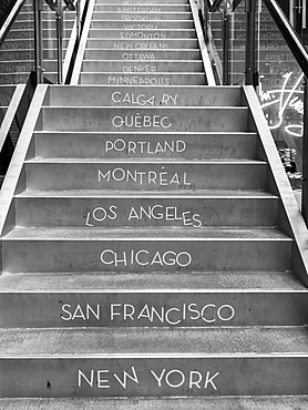 Canadian and American city names written on steps, Gastown, Vancouver, British Columbia, Canada