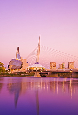 Winnipeg skyline from St. Boniface showing the Red River, Esplanade Riel Bridge and Canadian Museum for Human Rights, Winnipeg, Manitoba, Canada