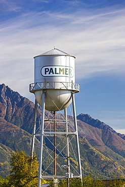 Downtown Palmer water tower, cloudy skies and the Chugach Mountains in the background, South-central Alaska,, Palmer, Alaska, United States of America