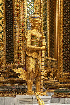 Temple of the Emerald Buddha golden guardian statue, Grand Palace, Bangkok, Thailand