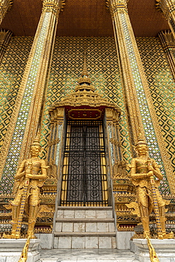 Temple of the Emerald Buddha golden guardians, Grand Palace, Bangkok, Thailand