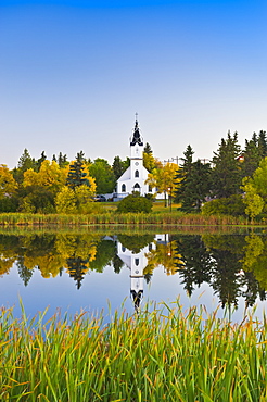 Ukrainian Catholic Church reflected in a lake, Camrose, Alberta, Canada