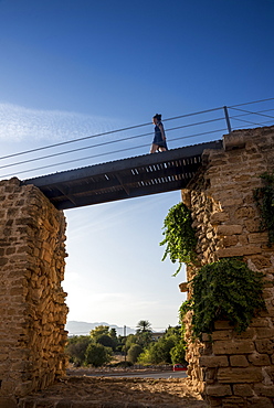 Tourist walking over the city wall, Alcudia, Mallorca, Balearic Islands, Spain