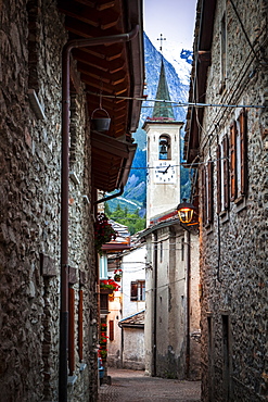 Ancient cobblestone streets lead to a church, Dolonne, near Courmayeur, Aosta Valley, Italy