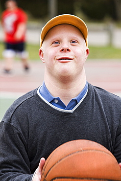 Man with Down Syndrome playing basketball