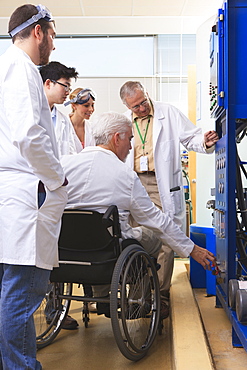 Professors explaining operation of water ultra purification system to engineering students in a laboratory