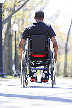 Man in a wheelchair who had Spinal Meningitis