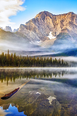 Tranquil lake with reflections in Elk Lakes Provincial Park; British Columbia, Canada