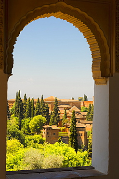 Arched window with a view from Alhambra; Granada, Andalusia, Spain