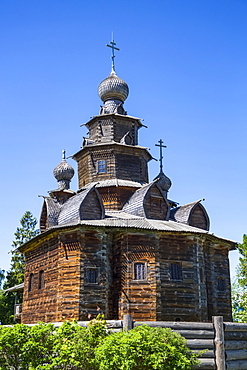 Wooden church building with onion domes and crosses, Museum of Wooden Architecture; Suzdal, Vladimir Oblast, Russia