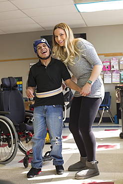 Boy with Spastic Quadriplegic Cerebral Palsy and teacher at school